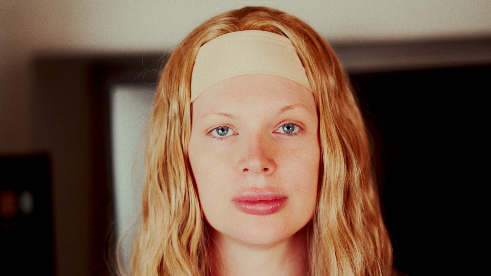 A contributor in close-up, looking into the camera